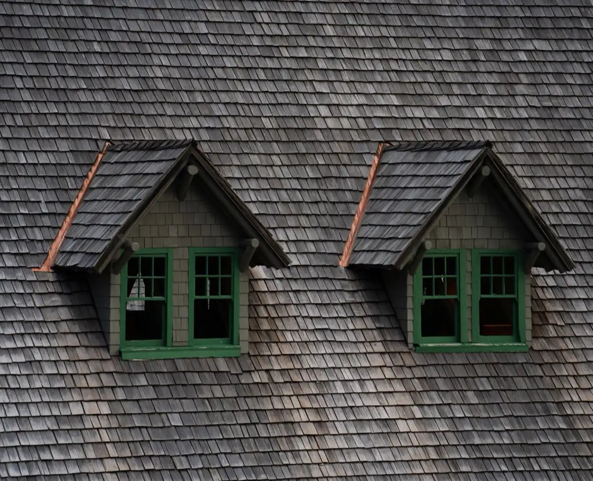 Dormers on a shingle roof in Pocatello, ID, where step flashing and kickout flashing carry water past the walls